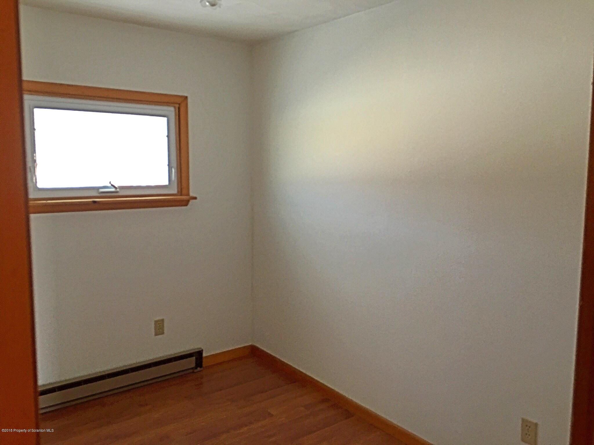 1668 Pennay Hill Road Kingsley, PA 18826 - Photo 17 of 23 an empty room with a window
