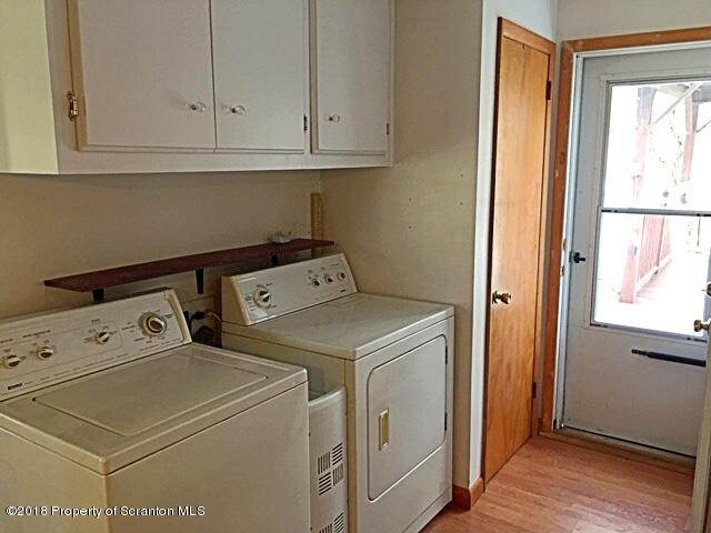 1668 Pennay Hill Road Kingsley, PA 18826 - Photo 18 of 23 a utility room with dryer and washer