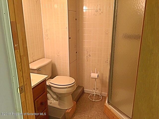 1668 Pennay Hill Road Kingsley, PA 18826 - Photo 21 of 23 a bathroom with a toilet and a shower