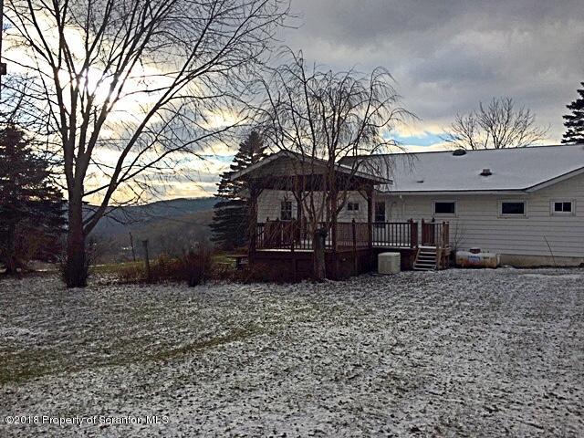 1668 Pennay Hill Road Kingsley, PA 18826 - Photo 4 of 23 a view of a house with a yard