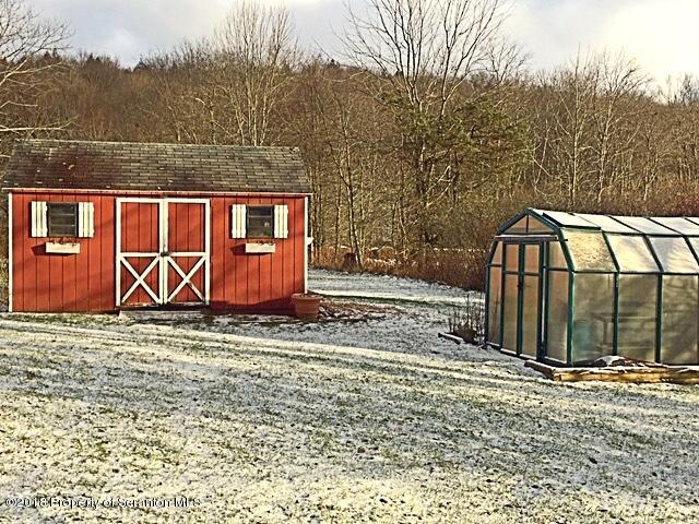 1668 Pennay Hill Road Kingsley, PA 18826 - Photo 6 of 23 a view of a backyard with wooden fence