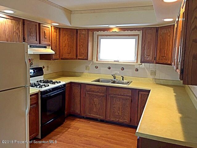 1668 Pennay Hill Road Kingsley, PA 18826 - Photo 10 of 23 a kitchen with stainless steel appliances granite countertop a sink stove and refrigerator