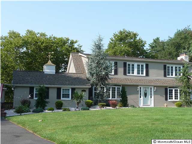 14 Nolan Road Morganville, NJ 07751 - Photo 1 of 3 a front view of a house with a garden