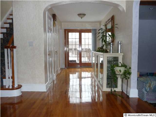 14 Nolan Road Morganville, NJ 07751 - Photo 2 of 3 a view of entryway and hall with wooden floor