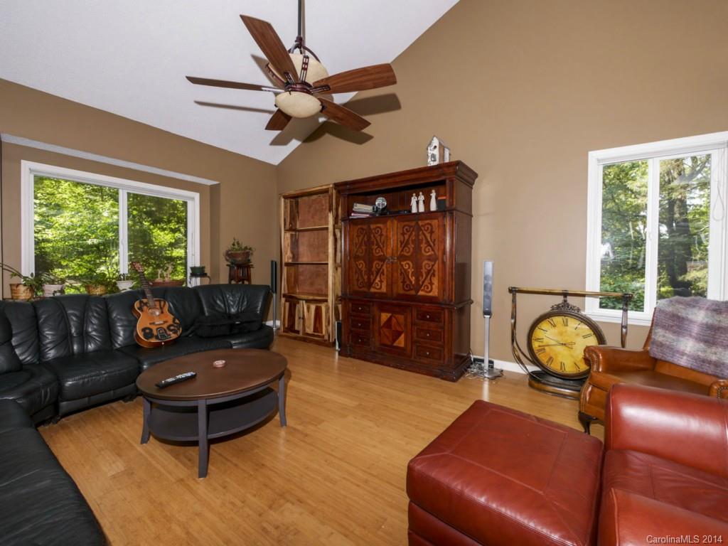 8108 Rising Meadow Road Charlotte, NC 28277 - Photo 2 of 21 a living room with furniture a window and a chandelier