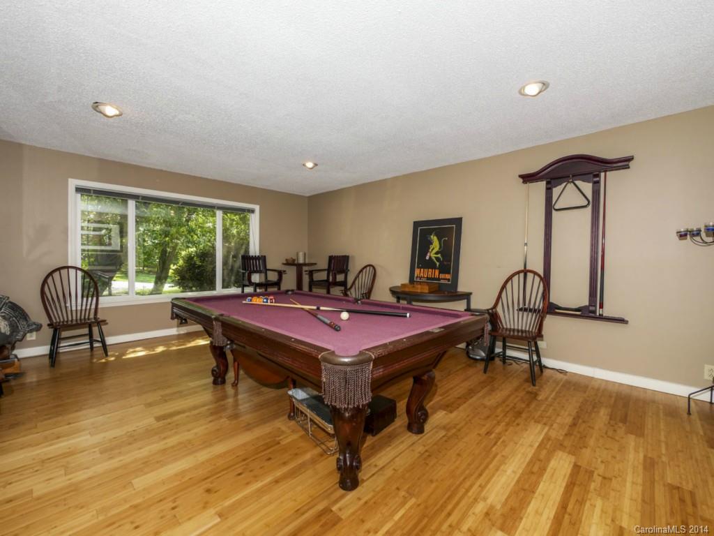 8108 Rising Meadow Road Charlotte, NC 28277 - Photo 13 of 21 a living room with furniture a rug and a floor to ceiling window