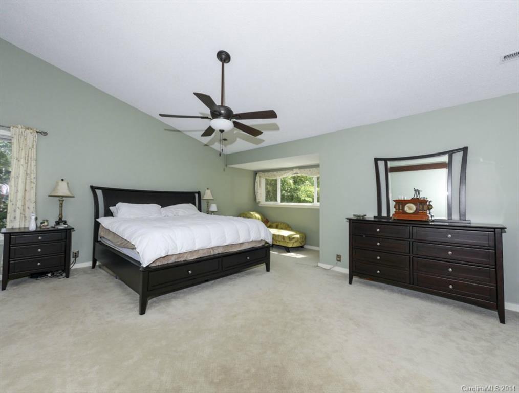 8108 Rising Meadow Road Charlotte, NC 28277 - Photo 17 of 21 a bedroom with a bed and a dresser
