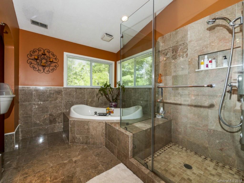 8108 Rising Meadow Road Charlotte, NC 28277 - Photo 19 of 21 a bathroom with a sink a toilet and shower