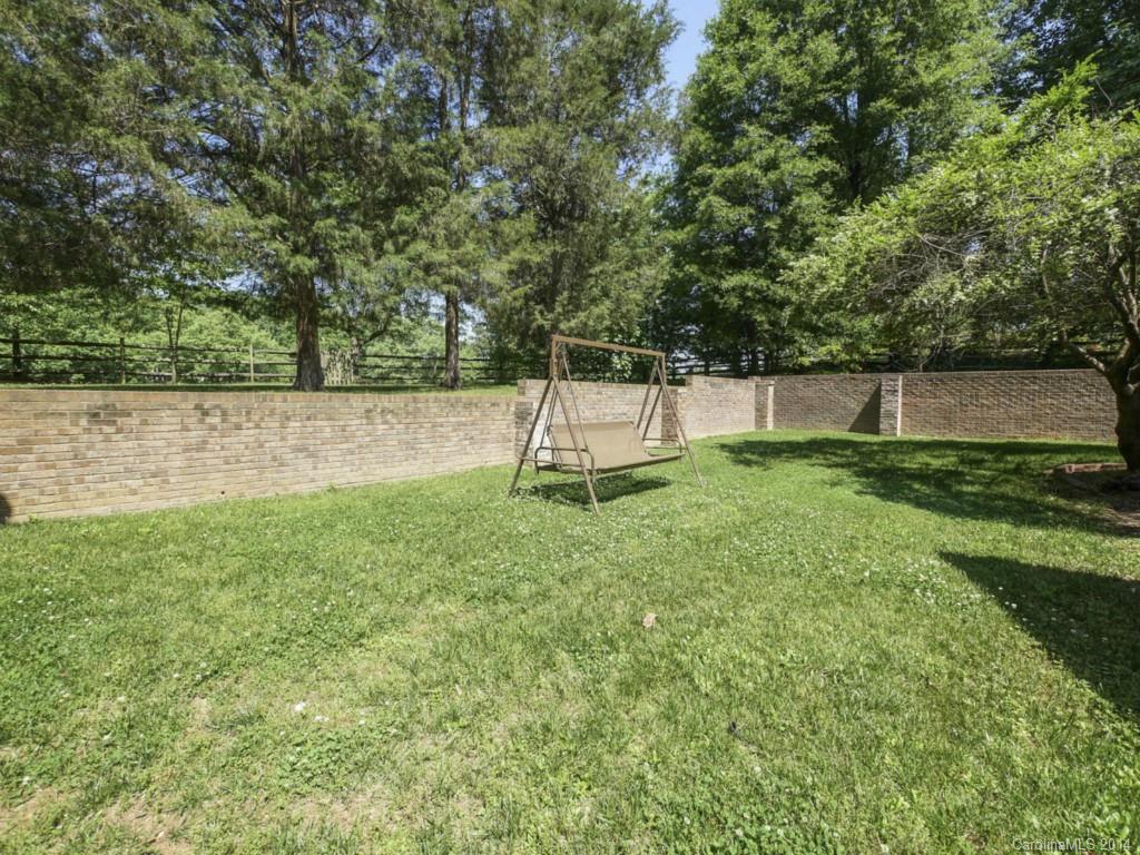 8108 Rising Meadow Road Charlotte, NC 28277 - Photo 20 of 21 a view of a backyard with a small cabin