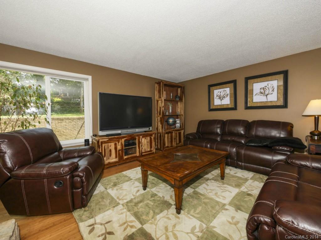 8108 Rising Meadow Road Charlotte, NC 28277 - Photo 5 of 21 a living room with furniture and a flat screen tv