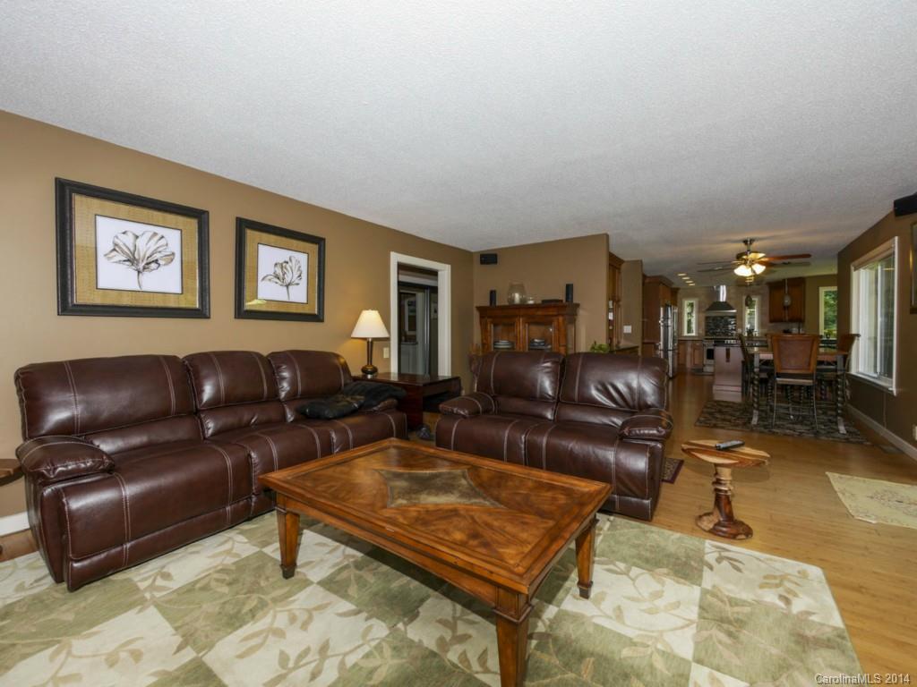 8108 Rising Meadow Road Charlotte, NC 28277 - Photo 6 of 21 a living room with furniture a dining table and a piano table