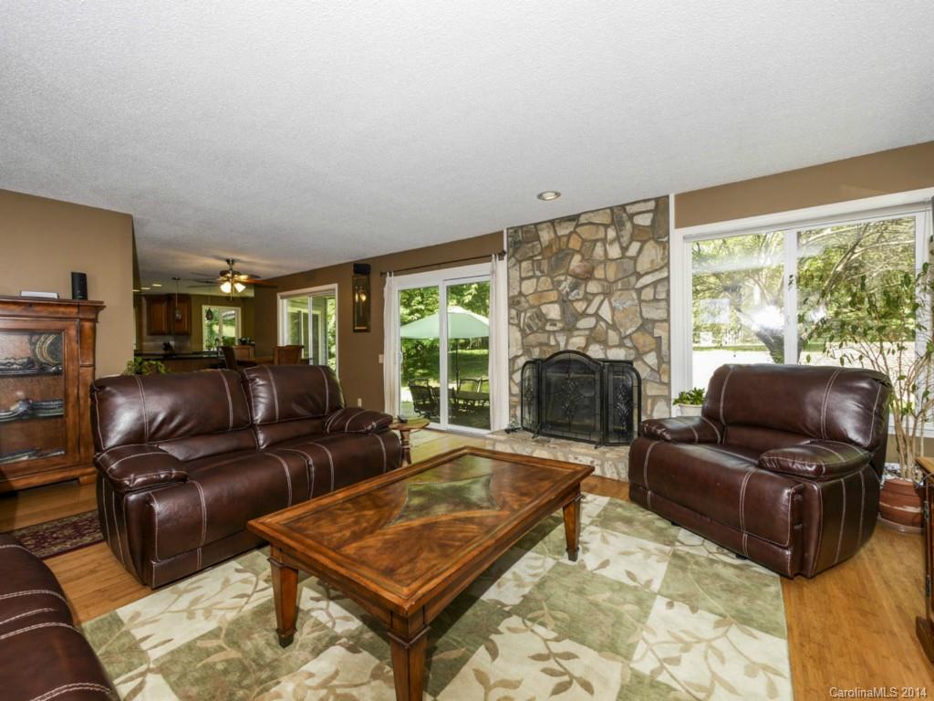 8108 Rising Meadow Road Charlotte, NC 28277 - Photo 7 of 21 a living room with furniture fireplace and a large window