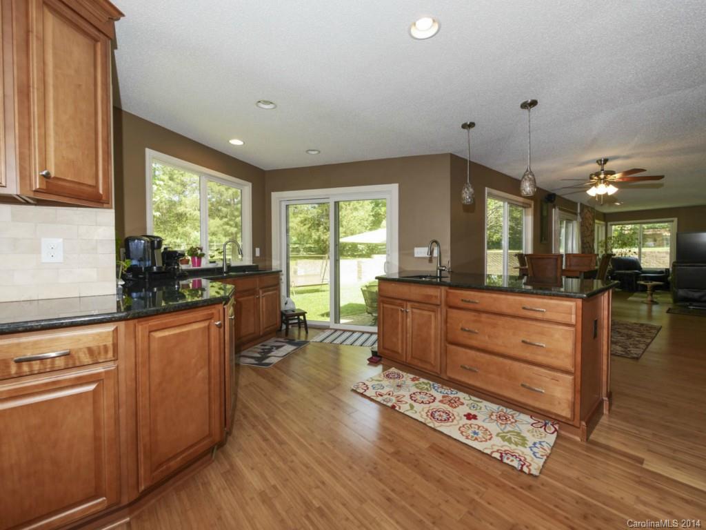 8108 Rising Meadow Road Charlotte, NC 28277 - Photo 9 of 21 a kitchen with sink cabinets and wooden floor