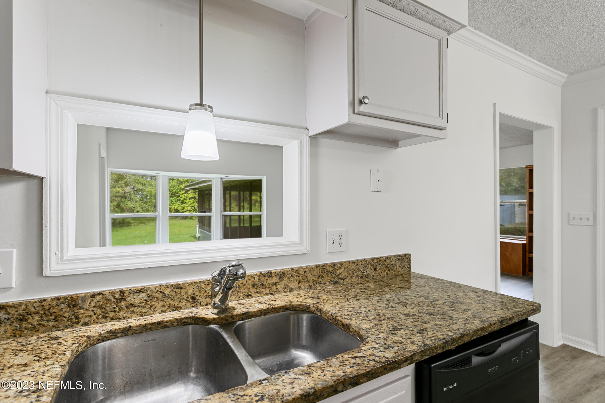2555 Pacetti Road, Unit AC St. Augustine, FL 32092 - Photo 19 of 50 a kitchen with stainless steel appliances granite countertop a sink and a granite counter tops