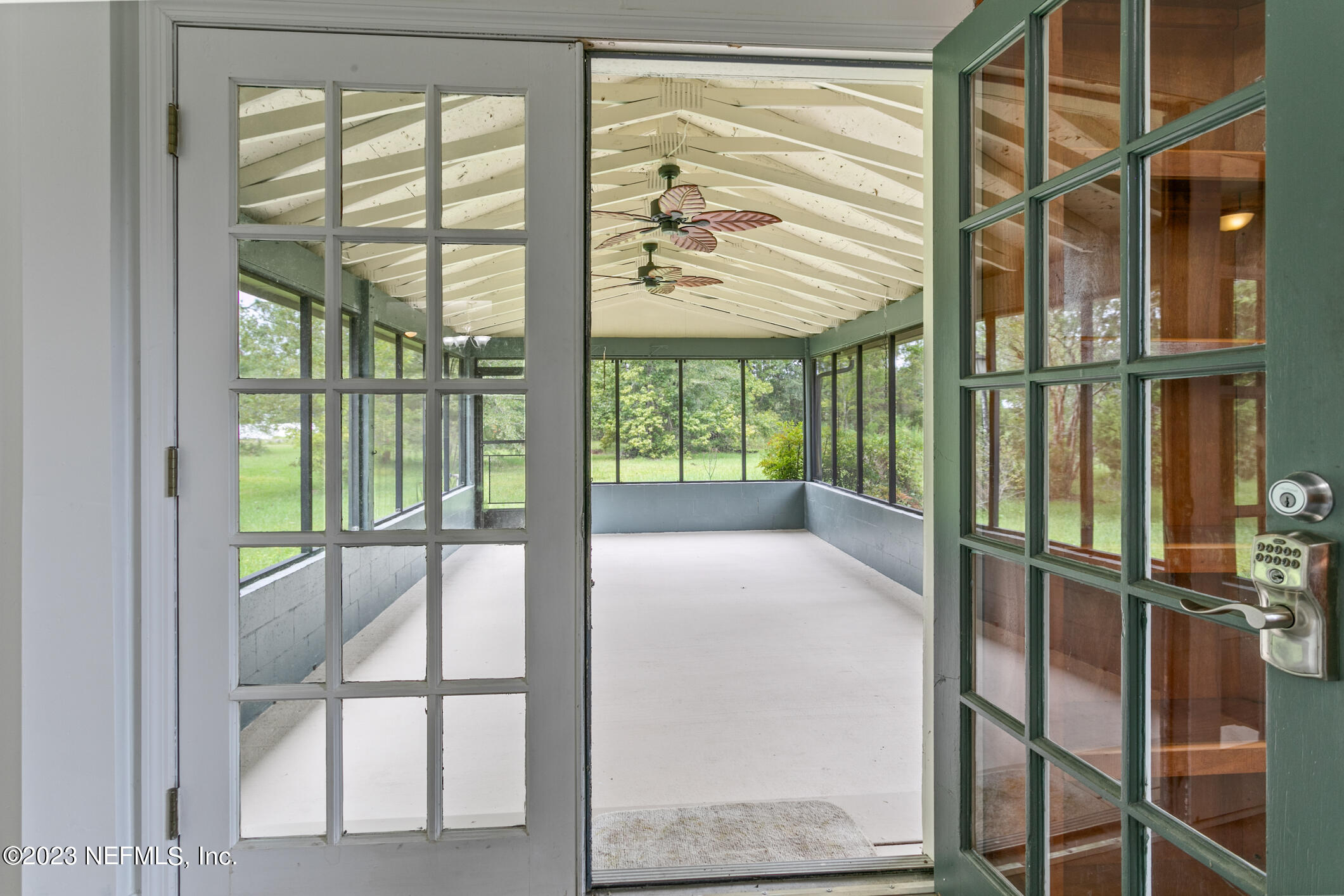 2555 Pacetti Road, Unit AC St. Augustine, FL 32092 - Photo 35 of 50 a bedroom with large windows