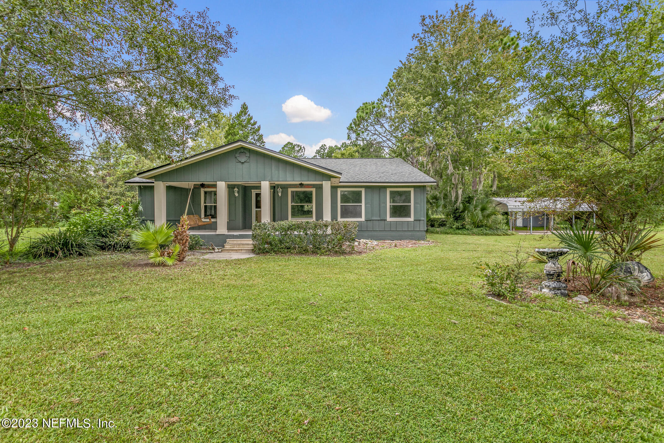 2555 Pacetti Road, Unit AC St. Augustine, FL 32092 - Photo 4 of 50 a front view of a house with a garden