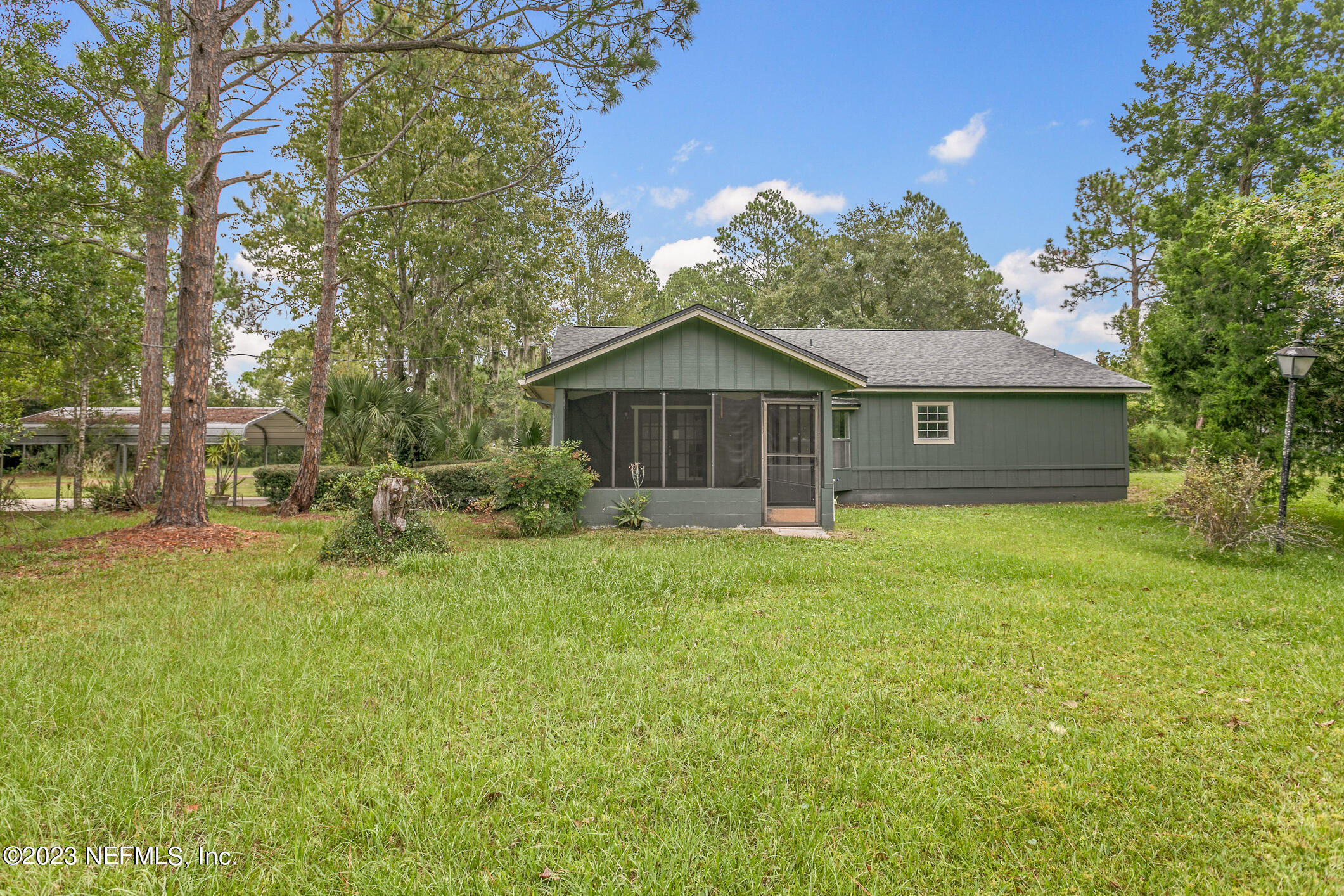 2555 Pacetti Road, Unit AC St. Augustine, FL 32092 - Photo 41 of 50 a front view of house with yard and green space