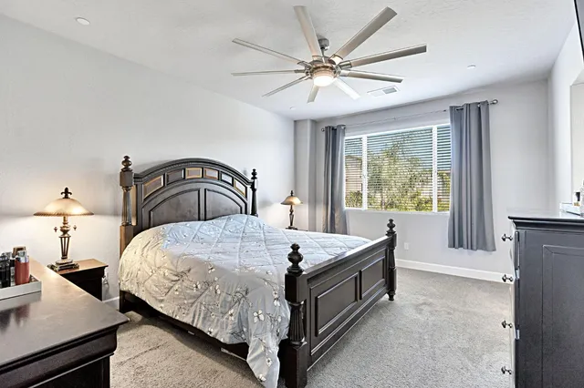 a bedroom with a bed and window