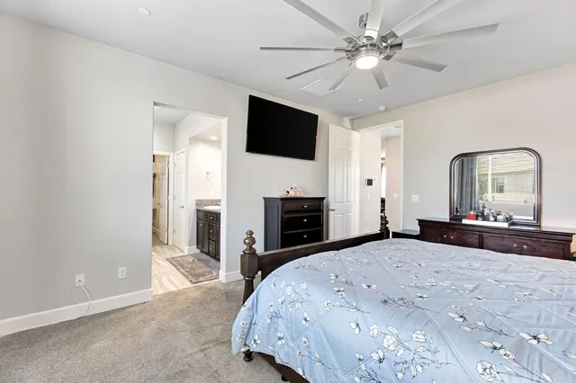 a bedroom with a bed and a fireplace