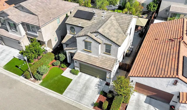 a aerial view of a house with a garden and plants