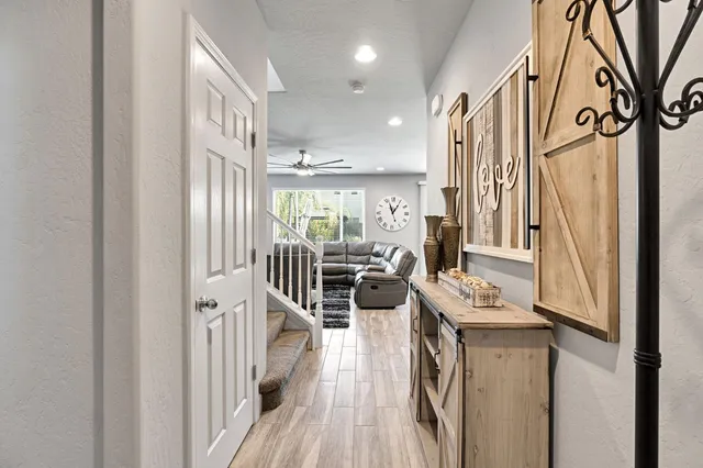 a open kitchen with stainless steel appliances granite countertop a refrigerator and a stove