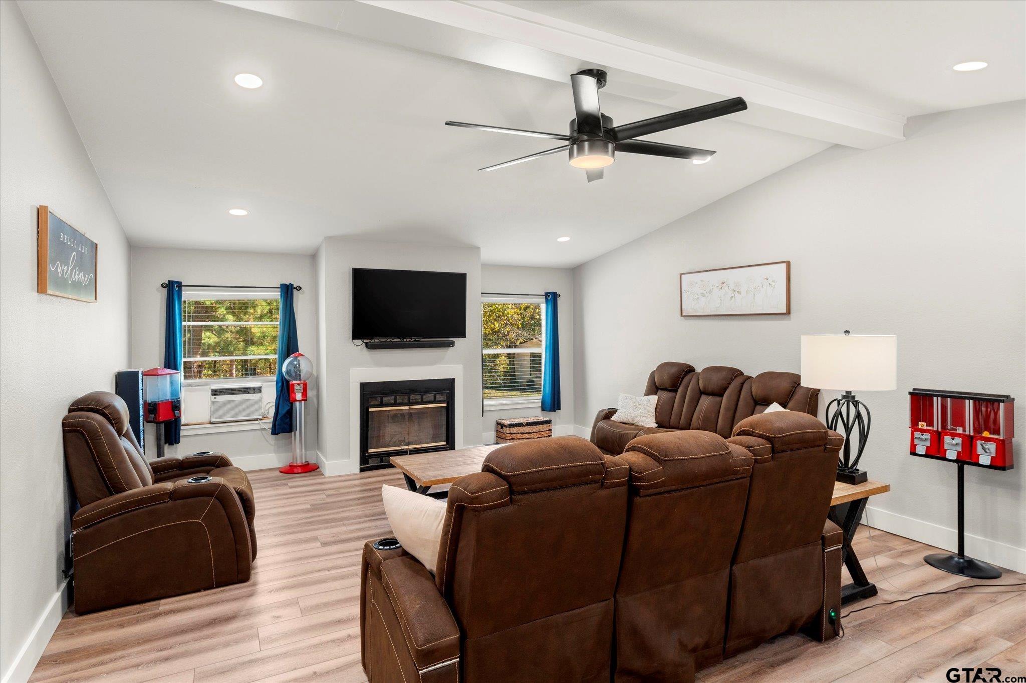 170 Private Road Leesburg, TX 75451 - Photo 20 of 46 a living room with fireplace furniture and a flat screen tv