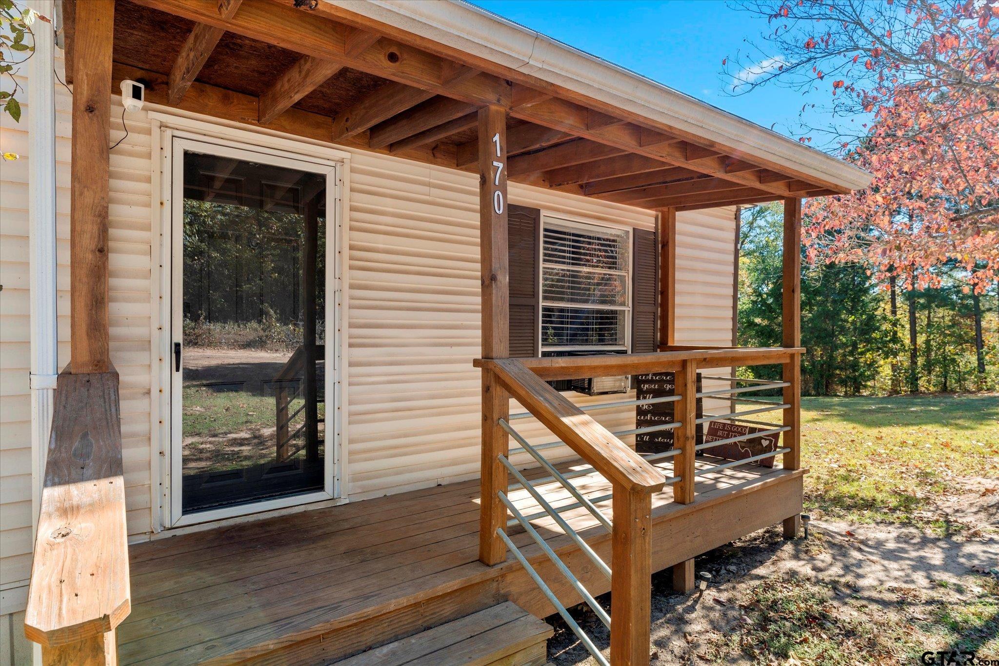 170 Private Road Leesburg, TX 75451 - Photo 3 of 46 a front view of a house with garden