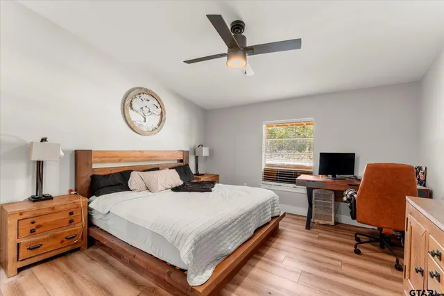 a bedroom with a bed and a table