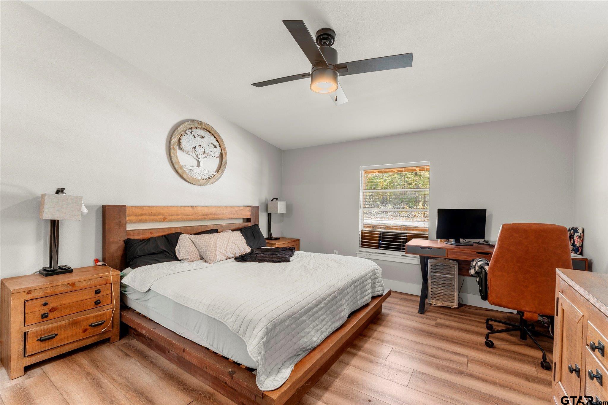 170 Private Road Leesburg, TX 75451 - Photo 32 of 46 a bedroom with a bed and a desk