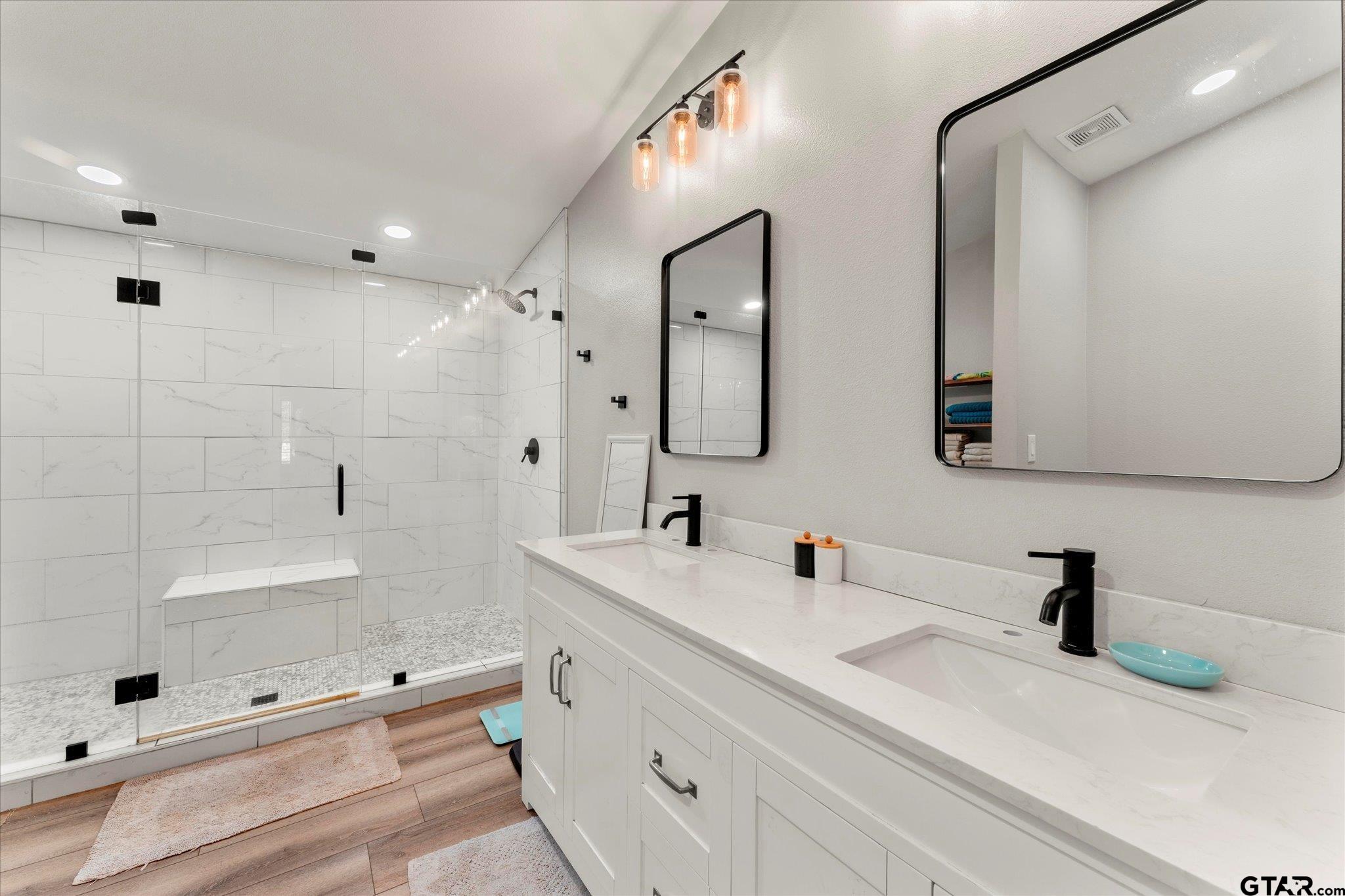 170 Private Road Leesburg, TX 75451 - Photo 36 of 46 a bathroom with double vanity sink and mirror