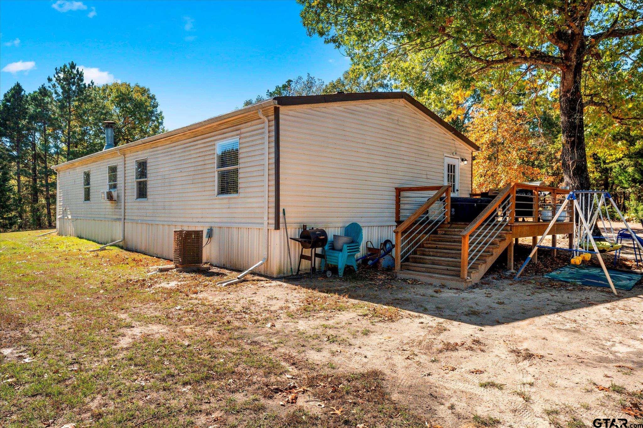 170 Private Road Leesburg, TX 75451 - Photo 8 of 46 a backyard of a house with oven and a tree
