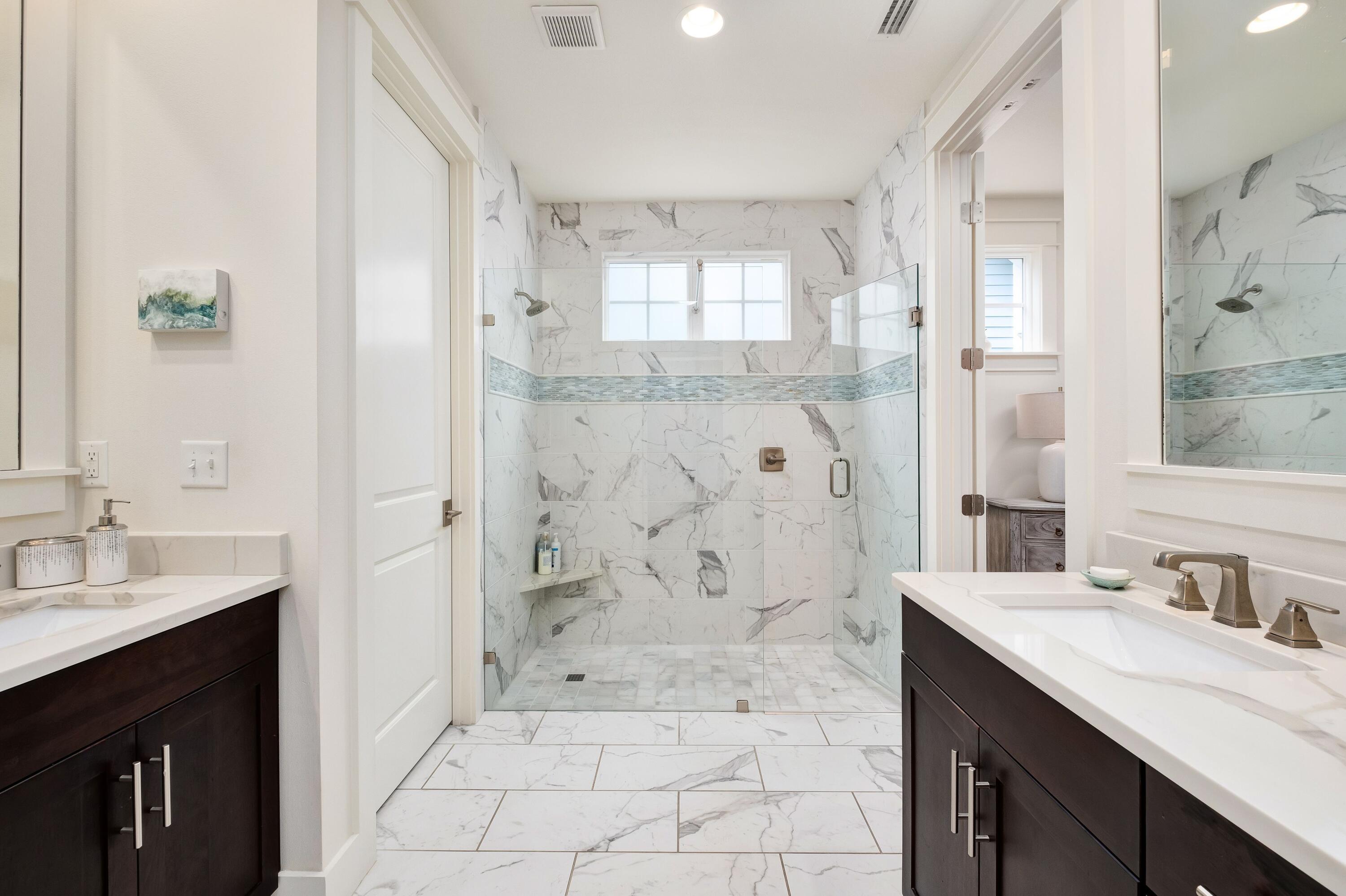 41 Carson Court Miramar Beach, FL 32550 - Photo 18 of 67 a bathroom with a granite countertop sink a shower and a mirror