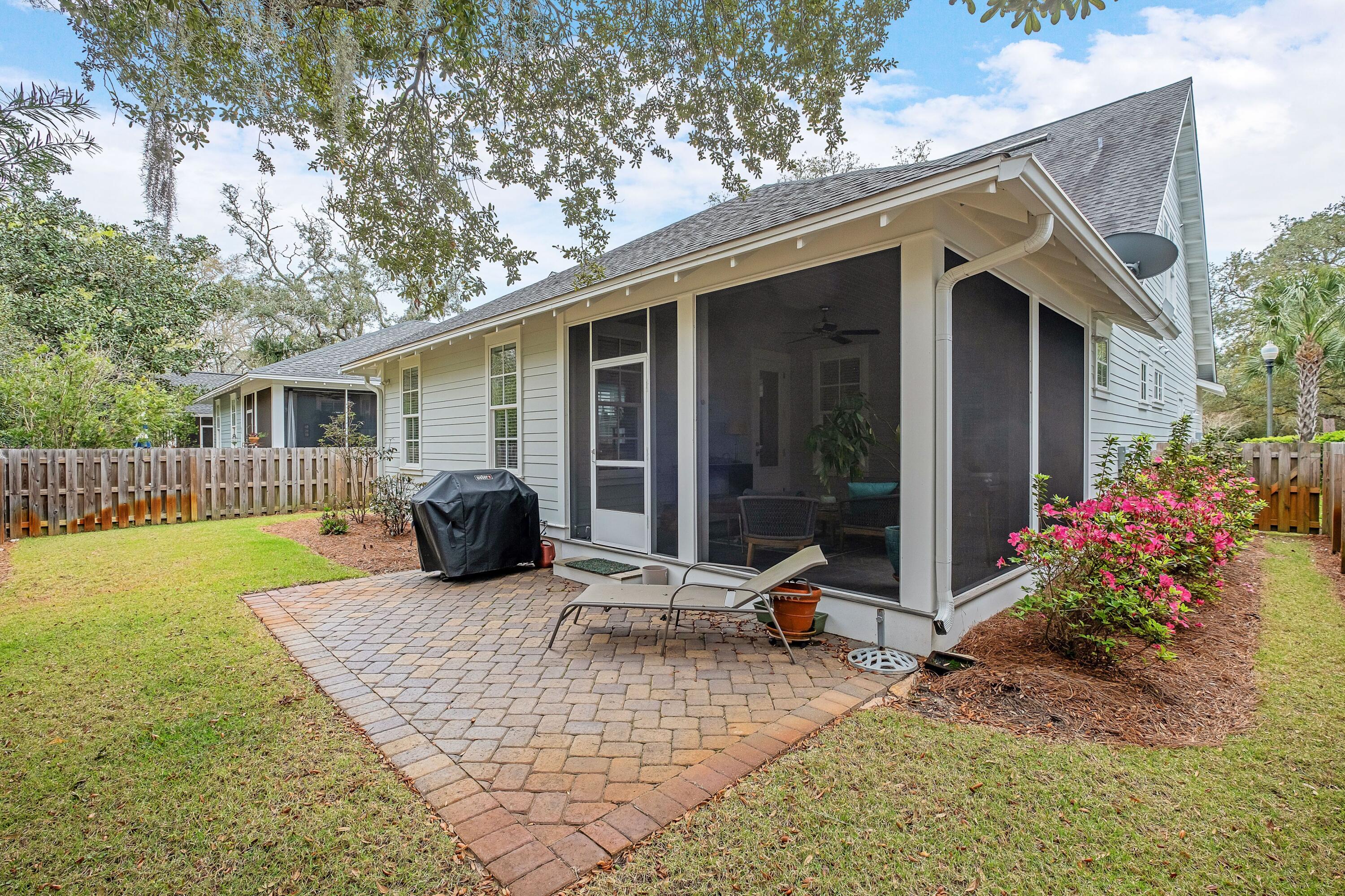 41 Carson Court Miramar Beach, FL 32550 - Photo 31 of 67 a view of a house with backyard sitting area and porch