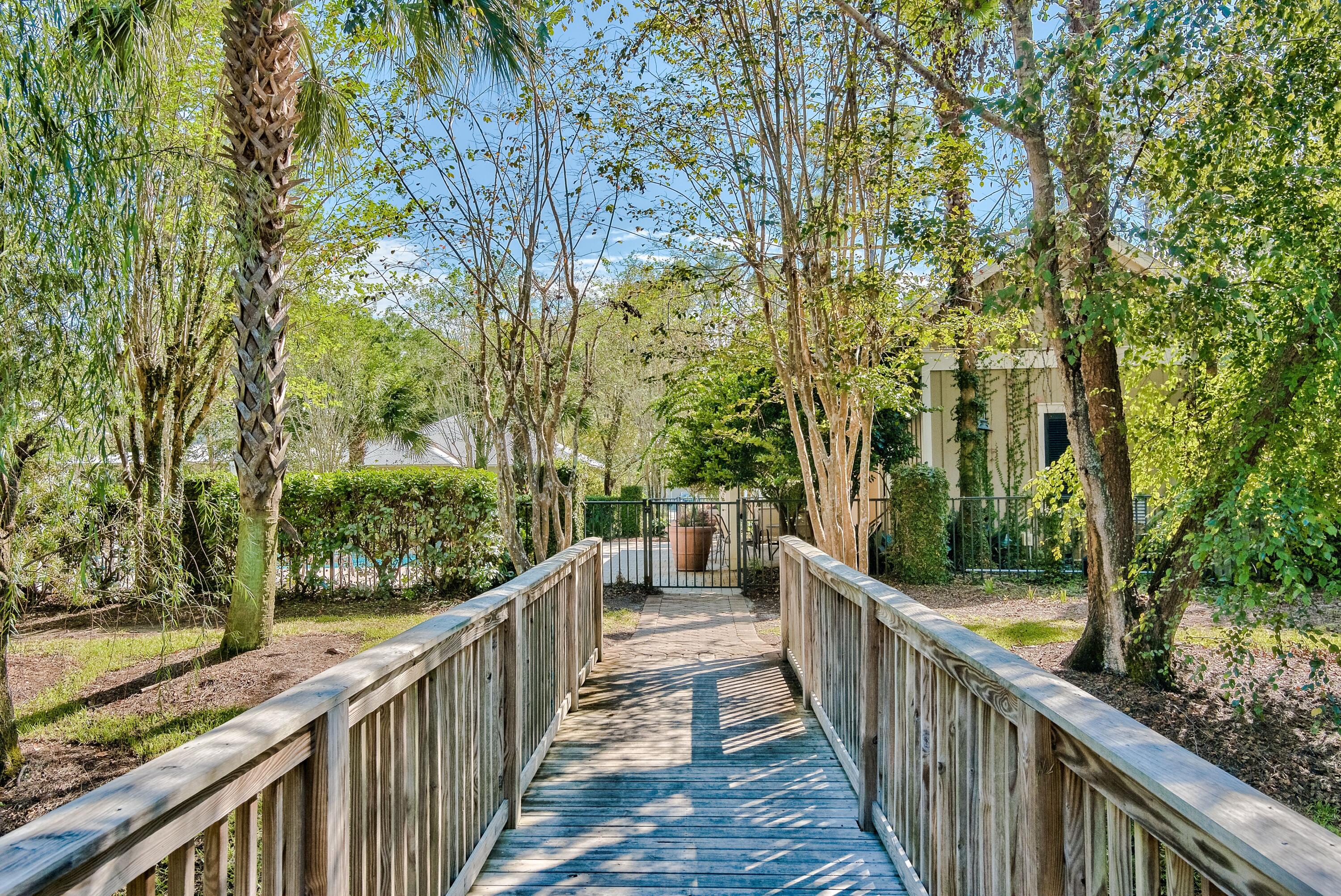 41 Carson Court Miramar Beach, FL 32550 - Photo 58 of 67 a view of a wooden balcony and trees