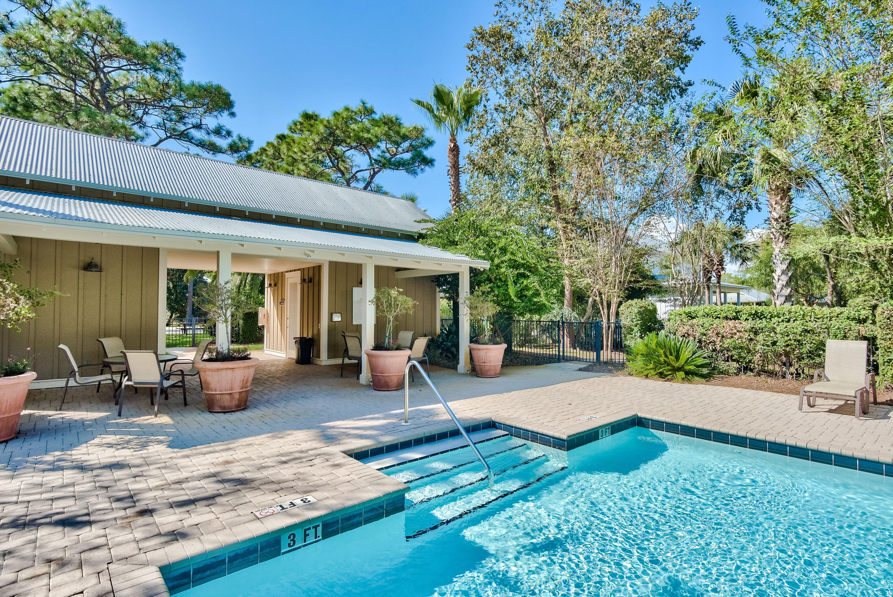 41 Carson Court Miramar Beach, FL 32550 - Photo 62 of 67 a view of a patio with furniture and floor to ceiling window