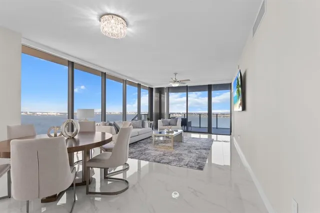 a view of a dining room with furniture window and outside view