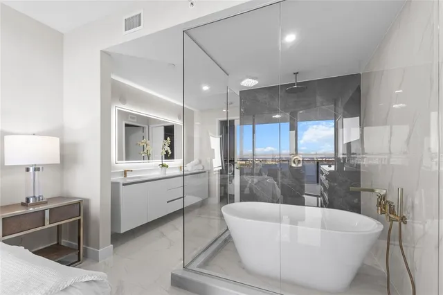 a bathroom with a bathtub and a sink