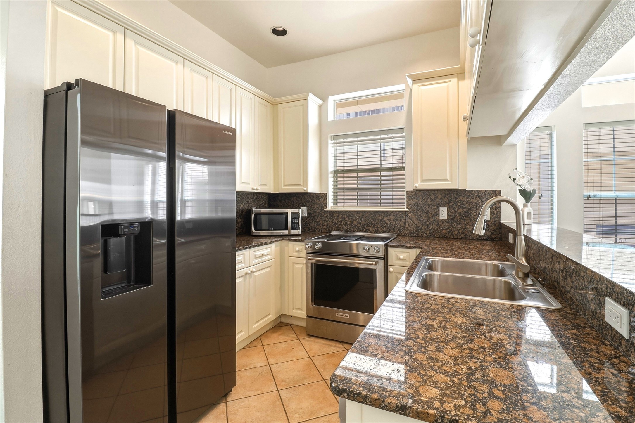 2918 Ranch Road 620, Unit 265 Austin, TX 78734 - Photo 12 of 40 Culinary delights await in this kitchen featuring abundant cabinetry and sleek stainless steel appliances.