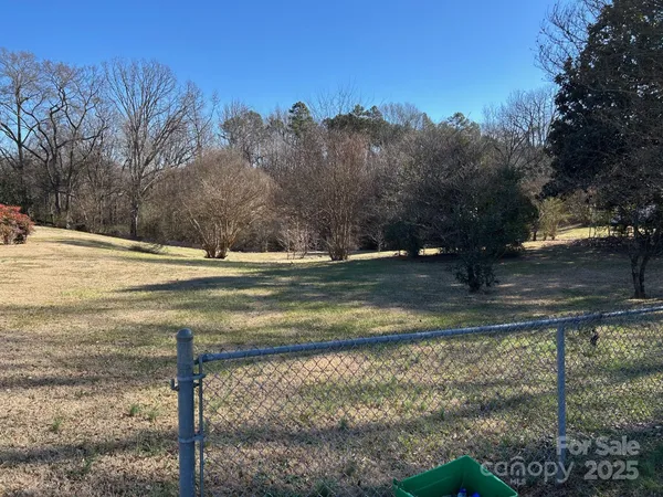 a view of a yard next to a house