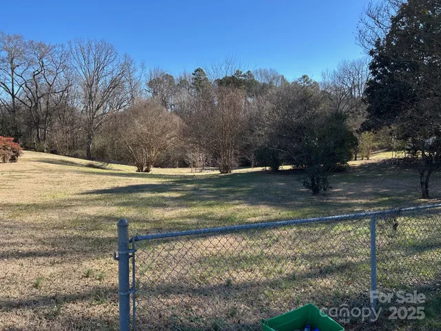 a view of a yard next to a house