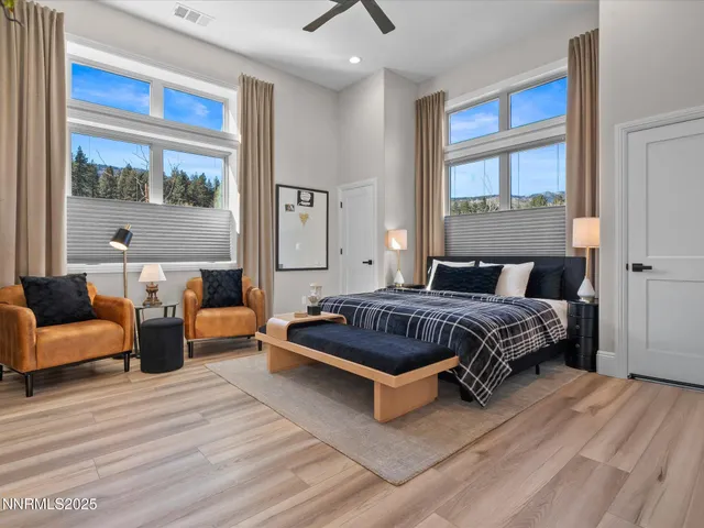 a kitchen with granite countertop white cabinets and black appliances