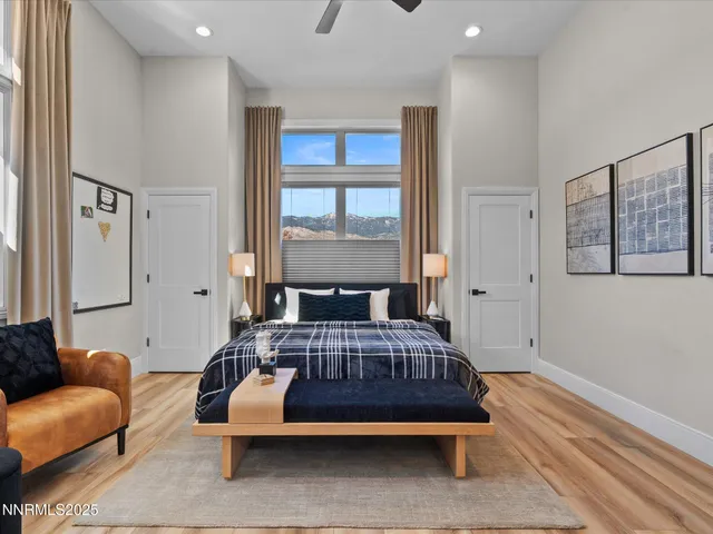 a bathroom with a granite countertop sink a toilet and a shower