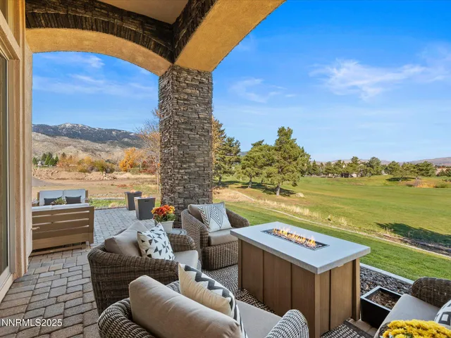 a view of a dining room with furniture and a table