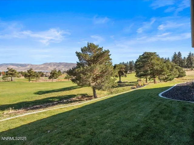 an aerial view of a house with a swimming pool