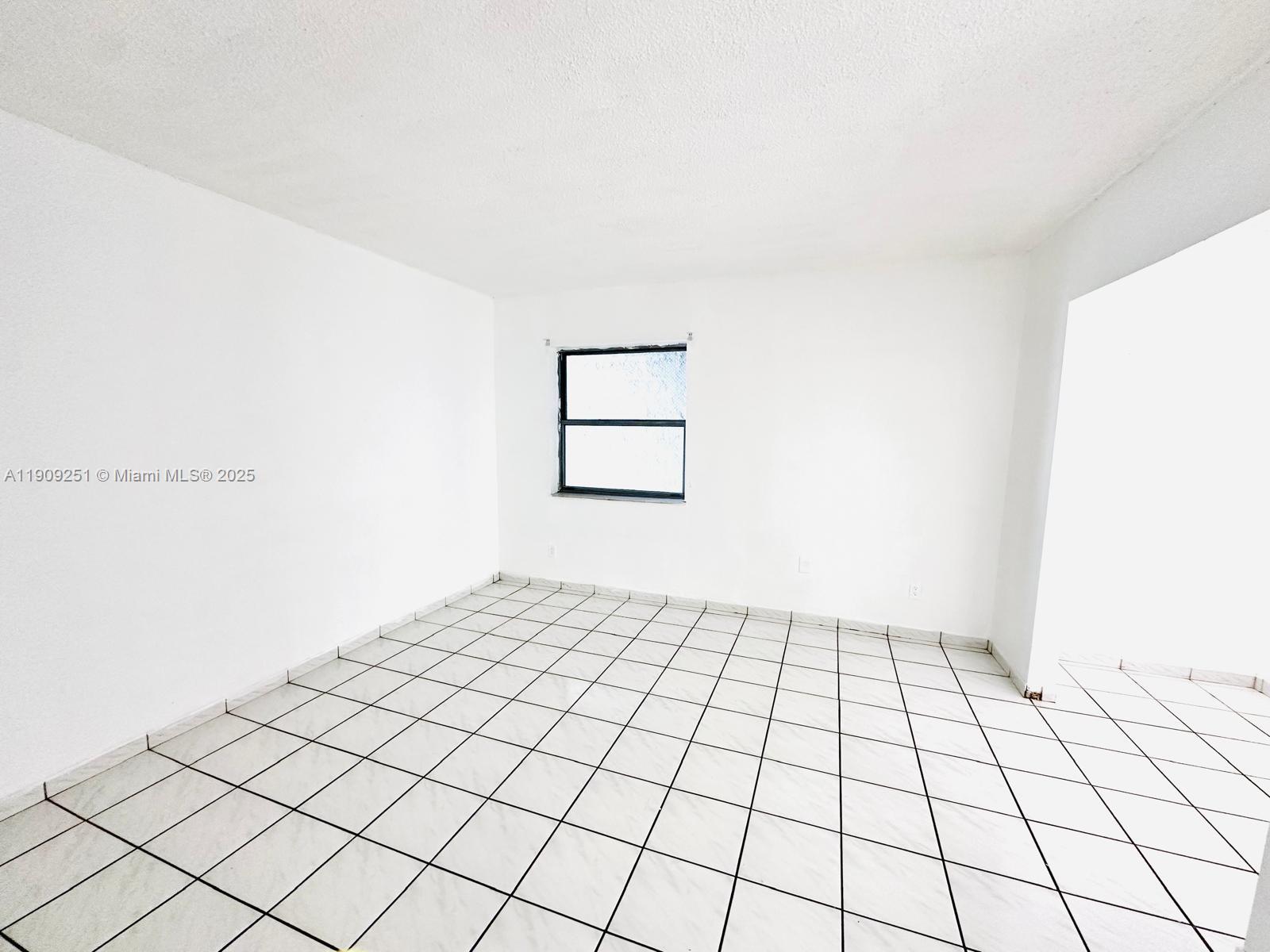 1750 West 46th Street, Unit 535 Hialeah, FL 33012 - Photo 18 of 26 a view of an empty room and window