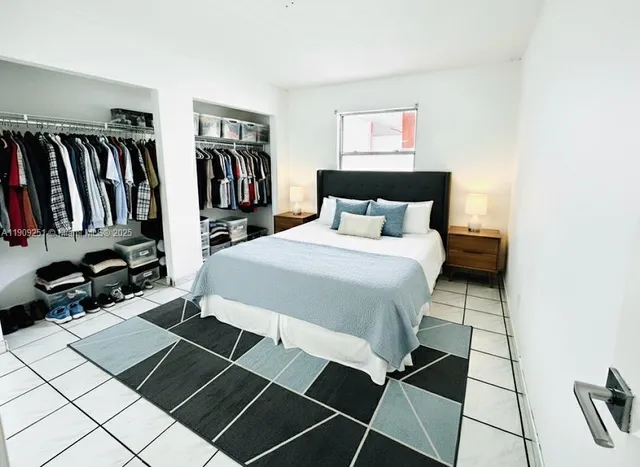 a bedroom with a bed and a book shelf