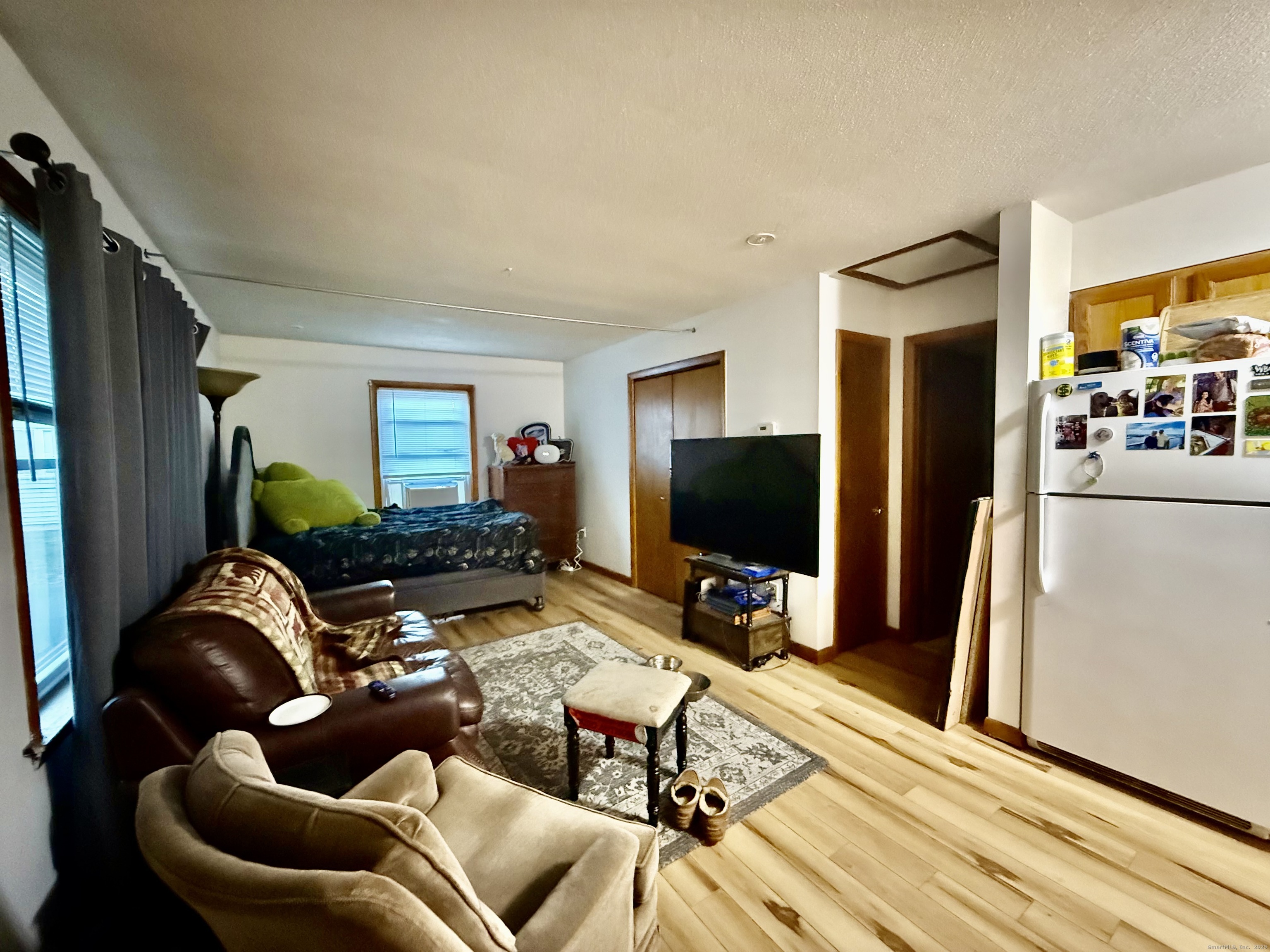 226 West High Street East Hampton, CT 06424 - Photo 12 of 21 a living room with furniture and a flat screen tv