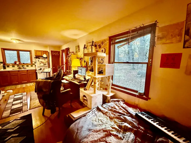 a view of a living room with furniture and a window