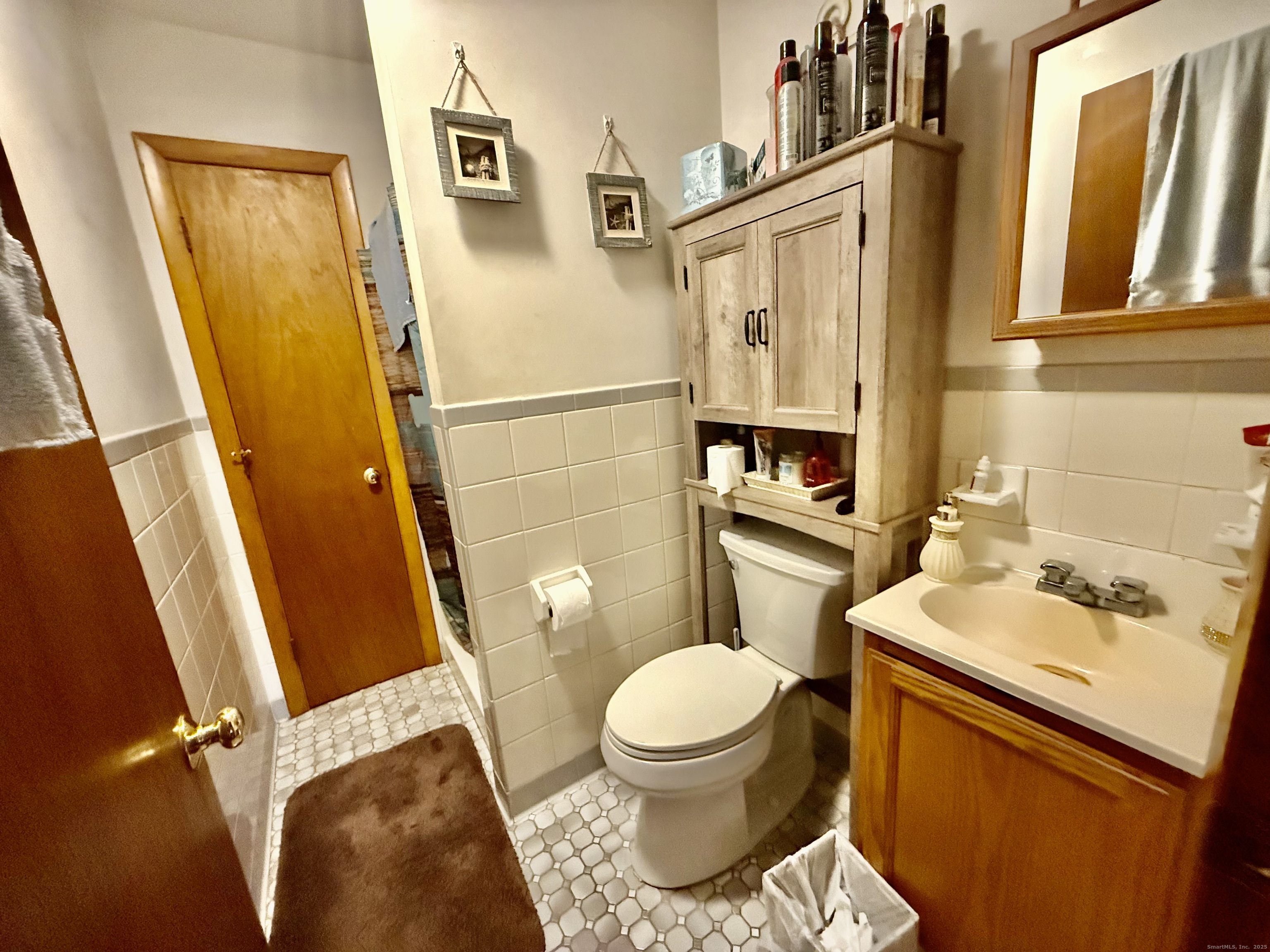 226 West High Street East Hampton, CT 06424 - Photo 18 of 21 a white toilet sitting next to a bathroom sink