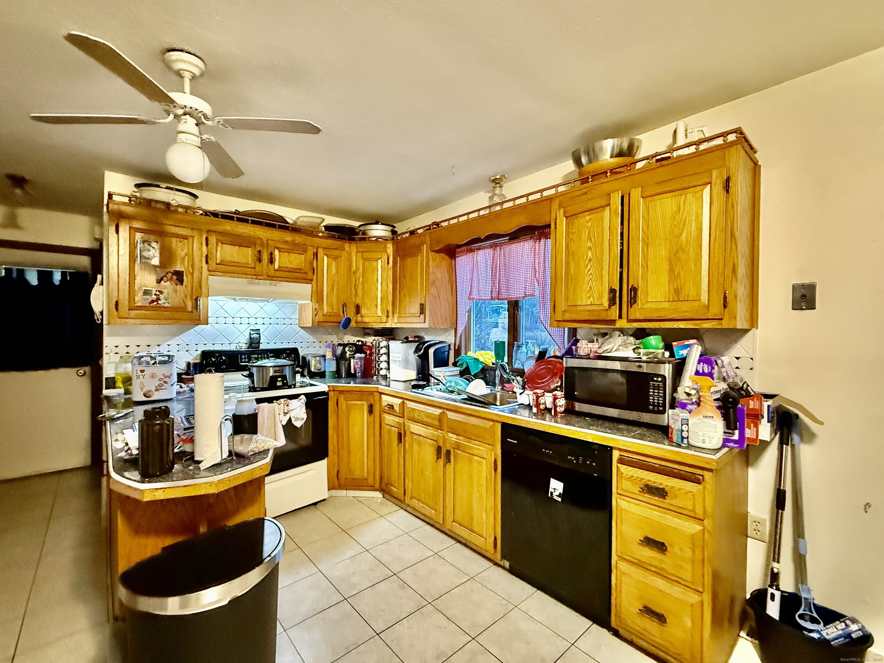 226 West High Street East Hampton, CT 06424 - Photo 7 of 21 a kitchen that has a lot of cabinets in it